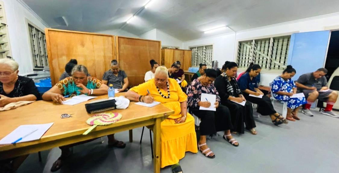 Participants working on personal budgets during the training